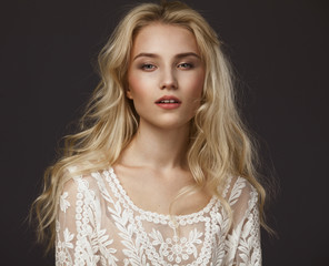 studio portrait of a beautiful young blond woman