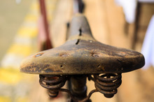 Old Vintage Leather Bicycle Seat / Close Up And Selective Focus..