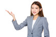 © leungchopan - Young businesswoman with open hand palm