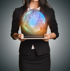 Poster - Close up Girl holding a digital globe over tablet