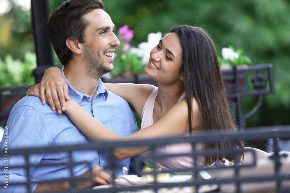 Young couple in street cafe