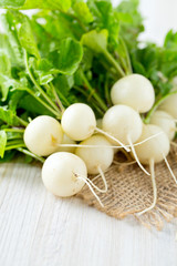 Poster - white radishes on wooden surface