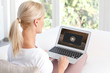 © sepy - Woman watching film on laptop