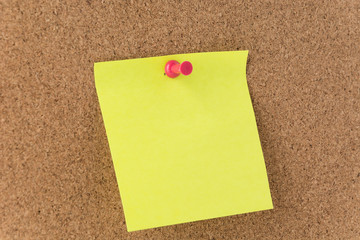 sticky note on cork board