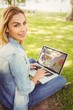 © WavebreakMediaMicro - Portrait of smiling woman using laptop