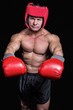 © WavebreakmediaMicro - Portrait of boxer with red gloves and headgear