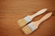 Paint brush on a wooden background.