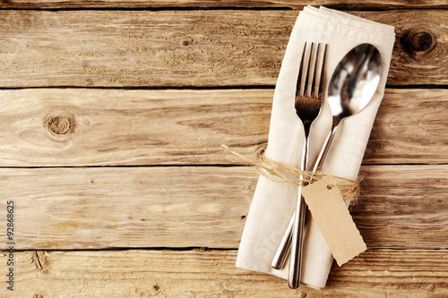 Fotografie, Obraz Spoon and Fork Tied on White Napkin with Tag