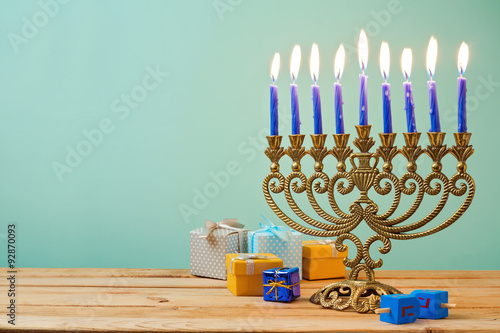 Cuadros en Lienzo Jewish holiday Hanukkah background with vintage menorah and gift boxes on wooden