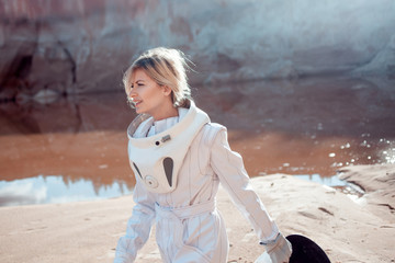 Wall Mural - Water on Mars, futuristic astronaut without a helmet in another