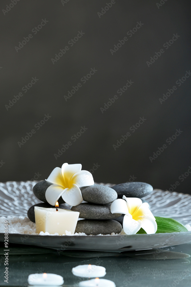 Still life with spa stones on dark background
