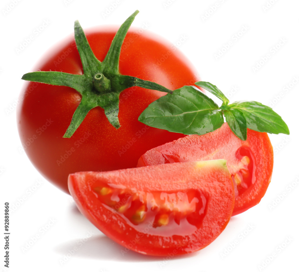 Whole and cut tomatoes isolated on white