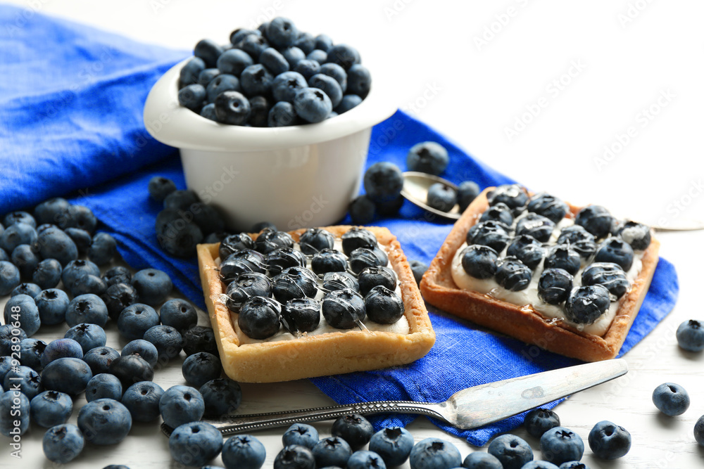 Gourmet fresh blueberry tarts on table