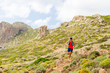 Trail running man in inspirational mountains