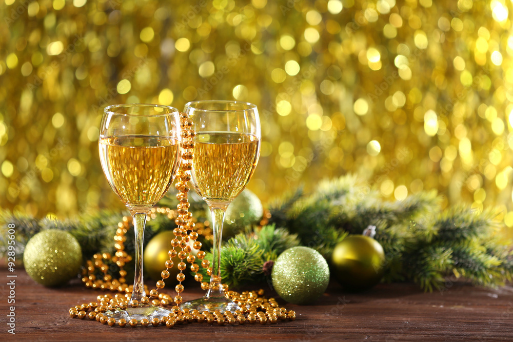 Champagne and Christmas decoration on bright background