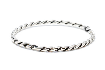 Silver slave bangle bracelet against a white background