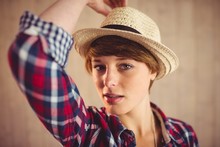 Attractive Redhead Woman Holding Her Hat
