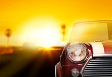 Retro Car Head Light On Street In The Sunset Background