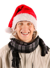 Wall Mural - Cheerful Young Man in Santa Hat