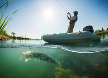 Fisherman With Rod In The Boat And Underwater View
