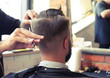 © ArtFamily - barber cutting hair with scissors