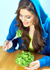 beautiful girl eating salad. female portrait.