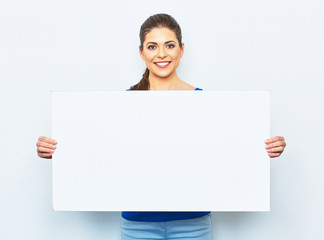 Wall Mural - young woman holding white blank signboard.