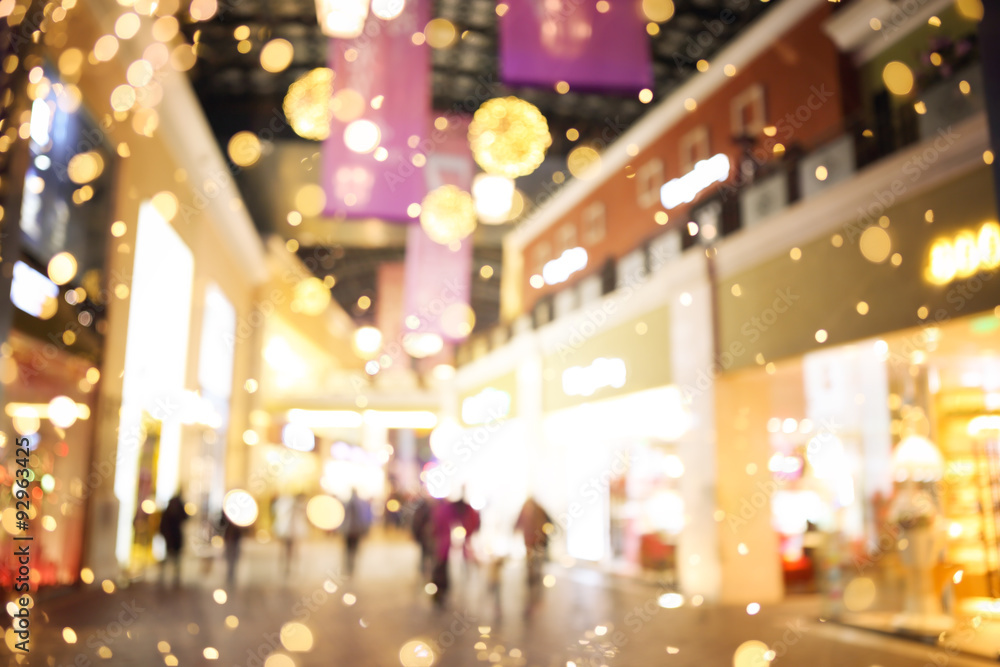 Shopping mall blur background with holiday lights
