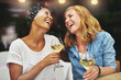 © Flamingo Images - Two young female friends celebrating and laughing