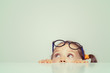 © Myst - cute little girl hiding behind the table