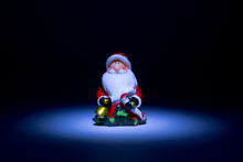 Santa Claus Lighted Torch From The Top Like A Fairy Tale On A Black Background
