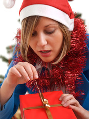 Canvas Print - Young woman with Christmas present