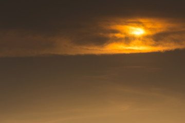 Wall Mural - golden sky with clouds cover sun