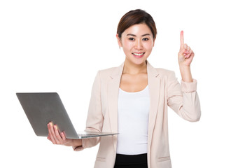 Canvas Print - Young businesswoman use of the notebook computer and finger up