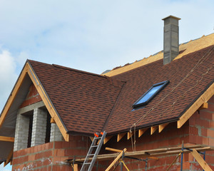 Wall Mural - Roofing and building new house with modular chimney, bitumen tile, skylights and eaves. Roofing construction.