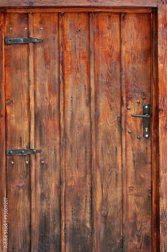 Fototapeta na wymiar Old Brown Planked Wood Door Detail