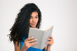 © Drobot Dean - Beautiful afro american woman reading book