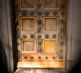 in london antique brown door  rusty  brass nail and light