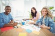 © WavebreakMediaMicro - Portrait of smiling business people working at desk
