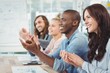 © WavebreakMediaMicro - Smiling business people clapping at desk