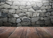 Wood Table With Stone Wall Background