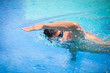 © lightpoet - Young man swimming the front crawl/freestyle in a pool