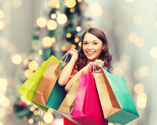 Smiling Woman With Colorful Shopping Bags
