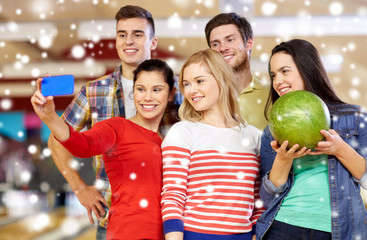 Poster - happy friends with smartphone in bowling club