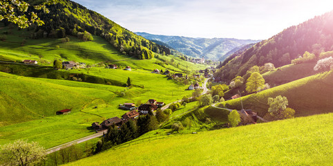 Scenic panorama view of a picturesque mountain village in Germany, Muenstertal, Black Forest. High-resolution summer vacation and ecology background.