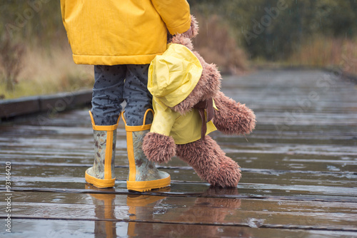 teddy bear with yellow raincoat