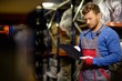 © Nejron Photo - Worker on a automotive spare parts warehouse