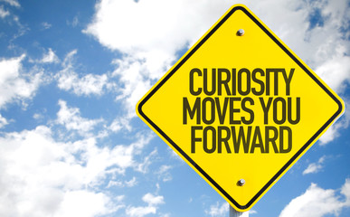 Curiosity Moves You Forward sign with sky background