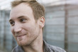 © Westend61 - Smiling young man outdoors