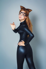 Young Woman In Latex Black Cat Costume